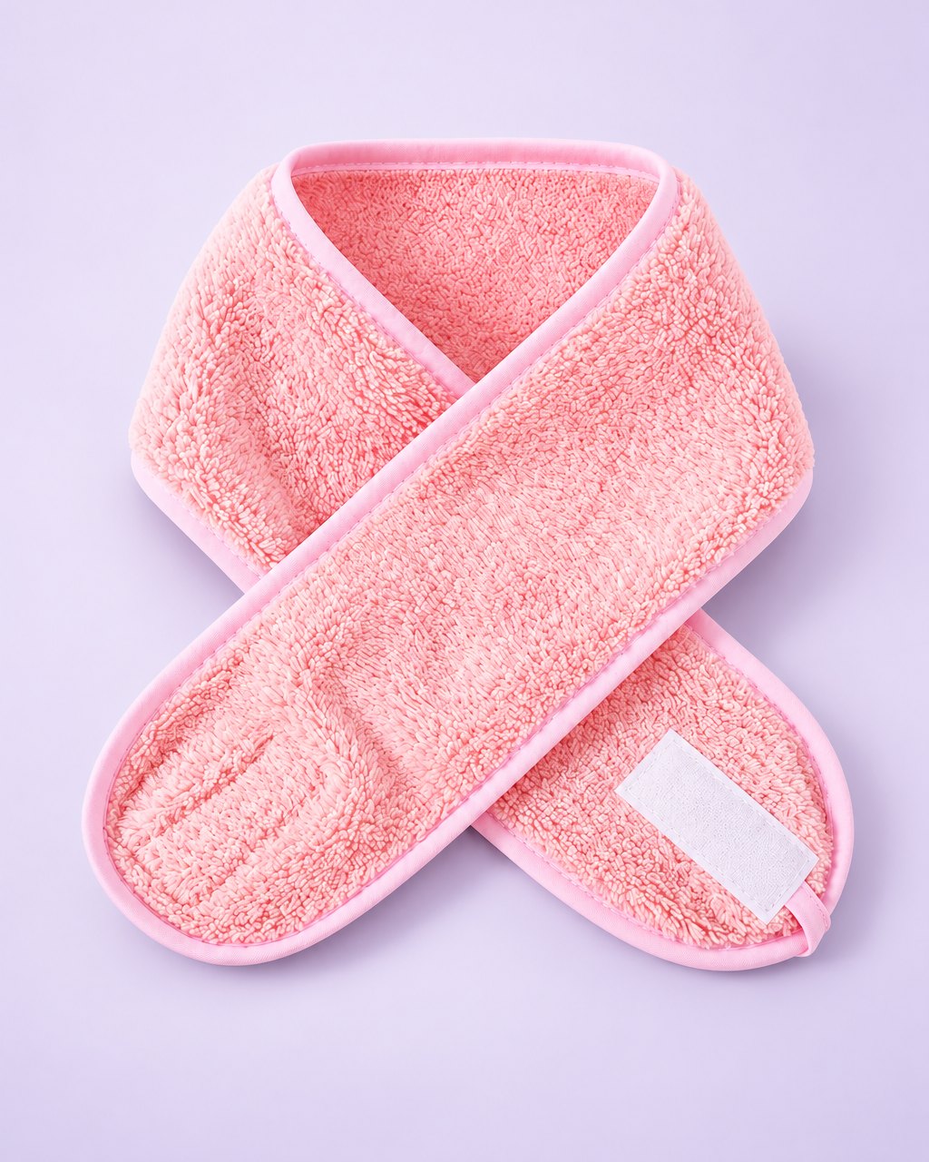 Pink plush spa headband with a hook-and-loop tab