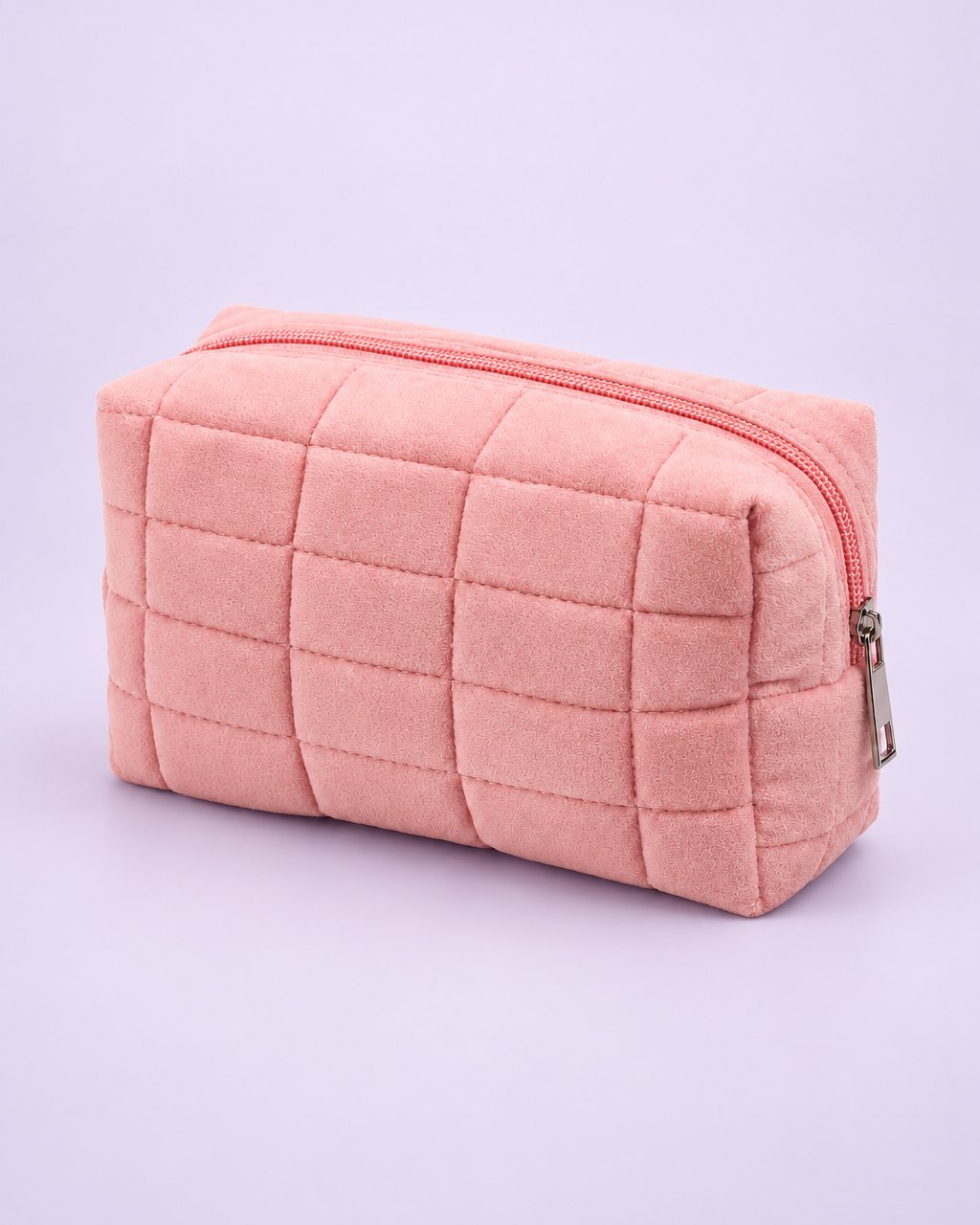 Pink puffy quilted makeup bag with a zip