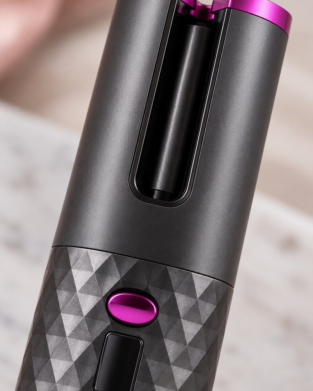 Close-up of the curler's open slot and the barrel inside the chamber