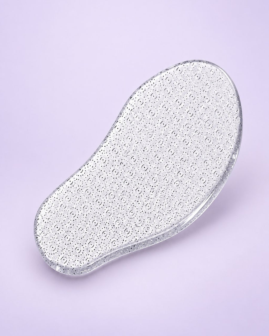 Clear mango-shaped nano glass foot file with an etched surface