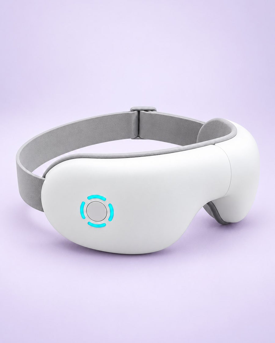 White heated eye massager with a grey head strap