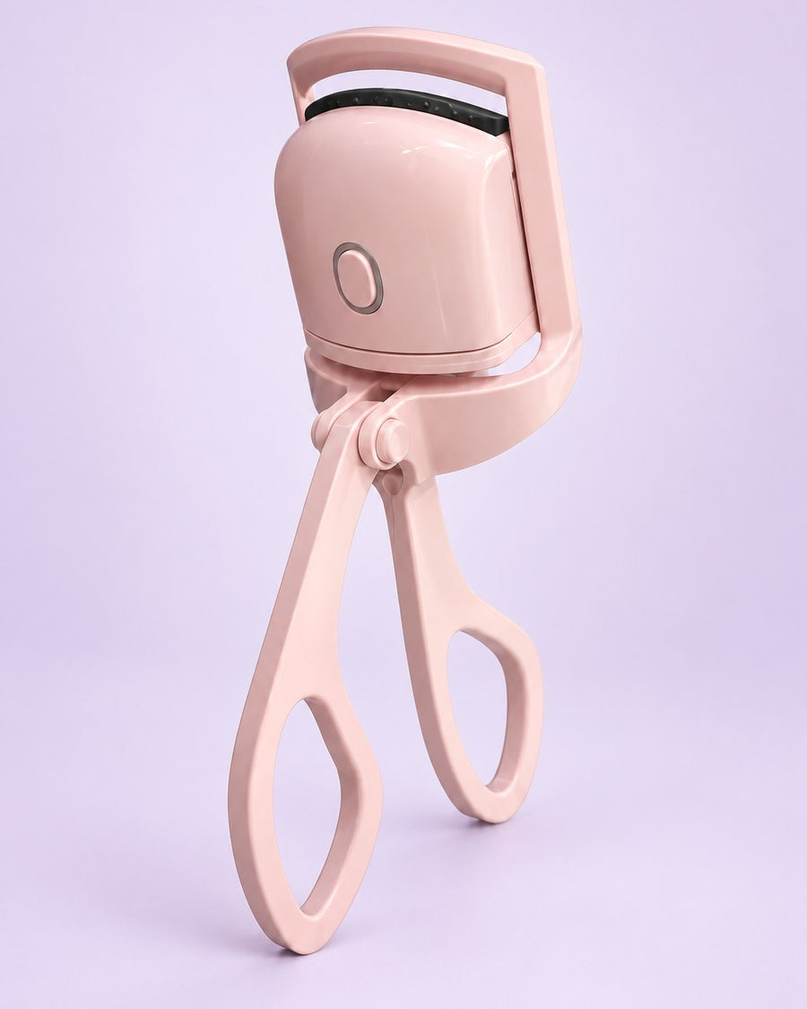 Pink heated lash curler with scissor handles