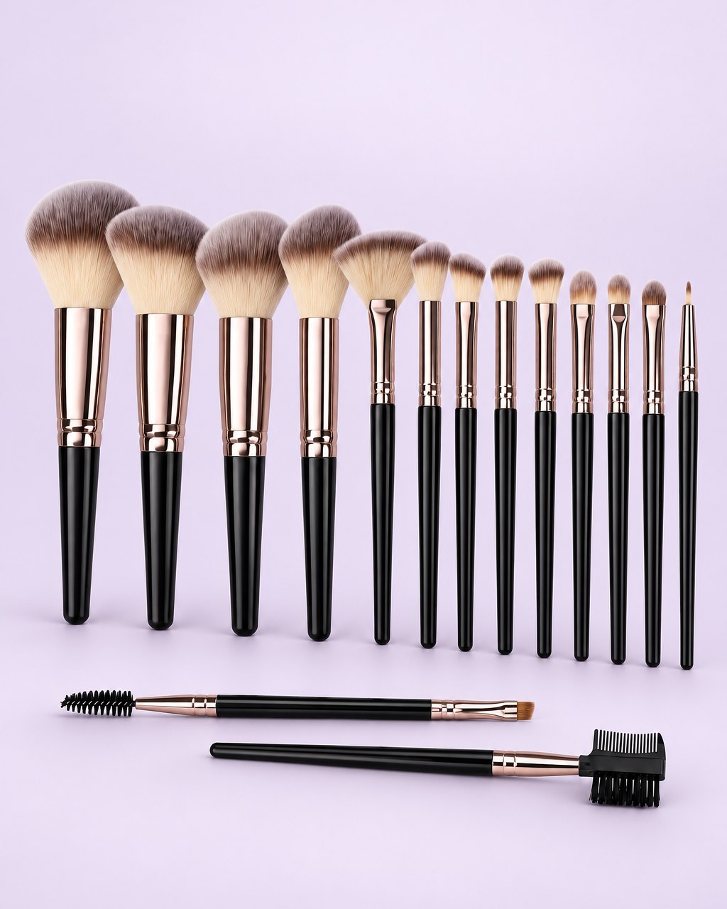 Fifteen black-handled makeup brushes with rose-gold ferrules lined up