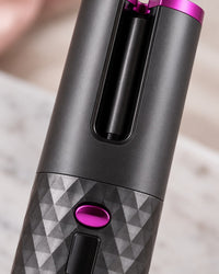 Close-up of the curler's open slot and the barrel inside the chamber
