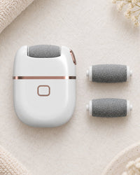 Callus remover laid out with its coarse and medium sanding rollers