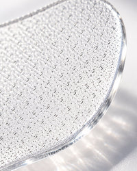 Macro close-up of the fine etched glass surface and polished edge