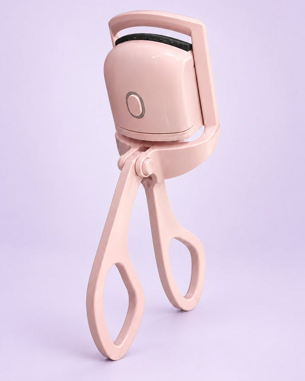 Pink heated lash curler with scissor handles