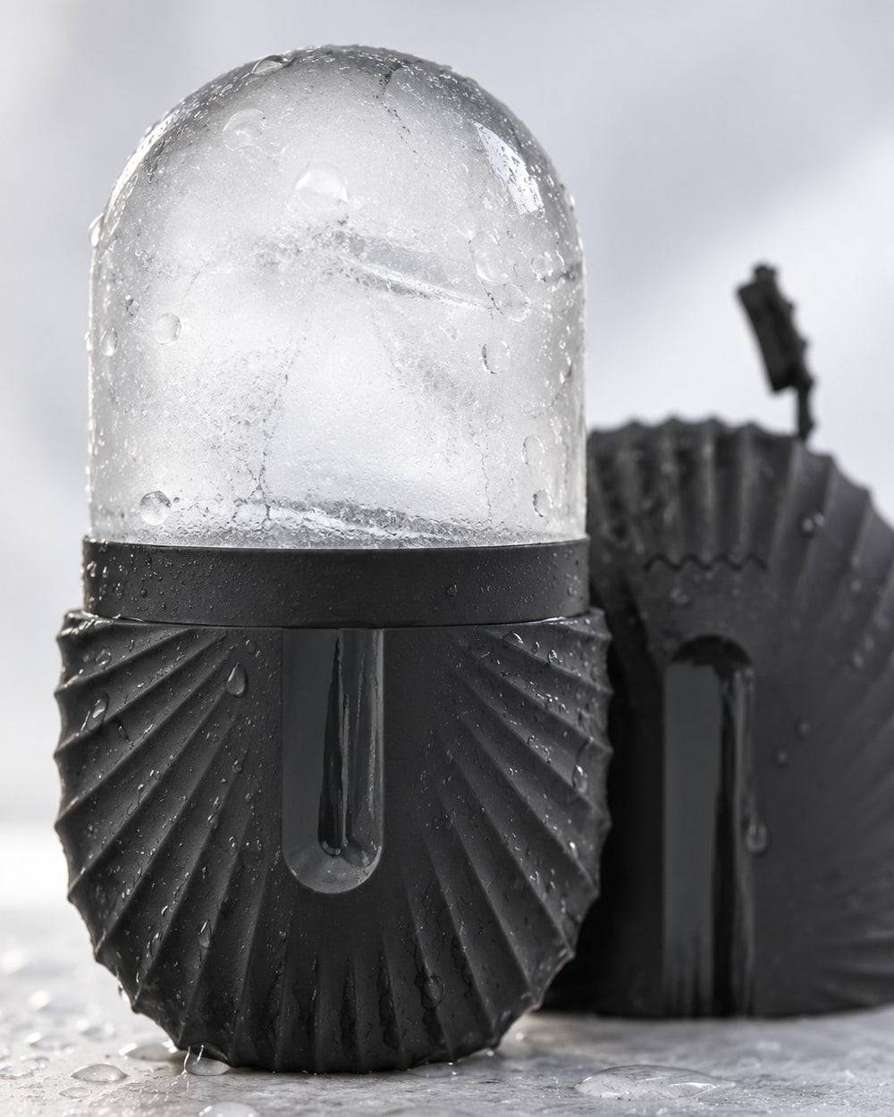 Close-up of the smooth frozen ice dome rising from the ribbed holder