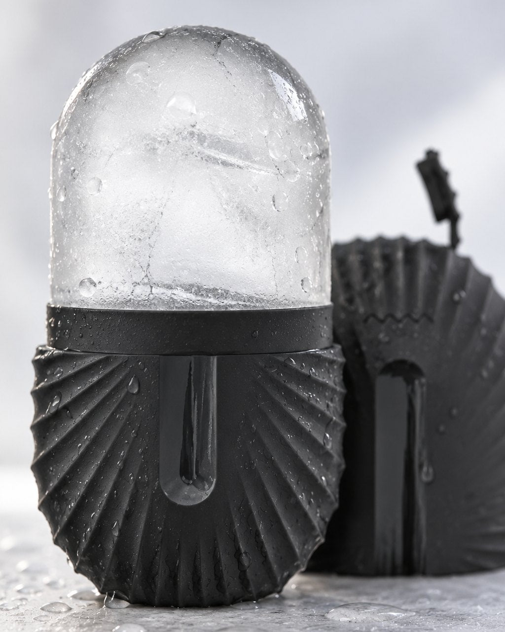 Close-up of the smooth frozen ice dome rising from the ribbed holder
