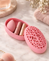 Lid lifted to show a beauty sponge stored inside