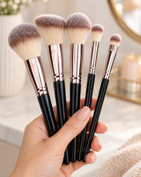 A handful of the brushes held in one hand