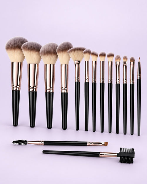 Fifteen black-handled makeup brushes with rose-gold ferrules lined up