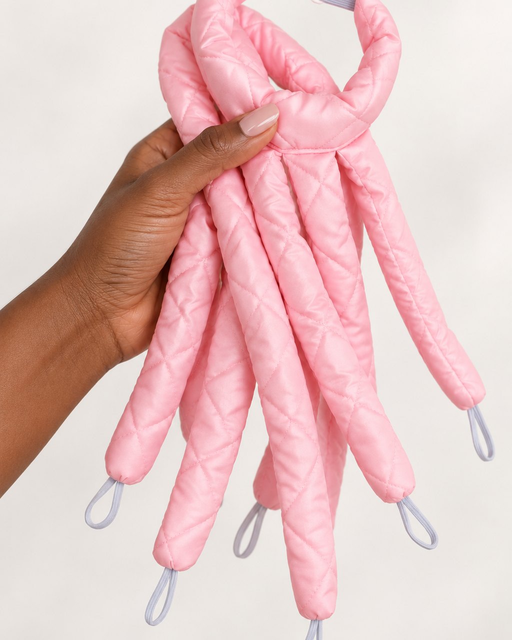 The octopus curler folded into a small bundle in one hand