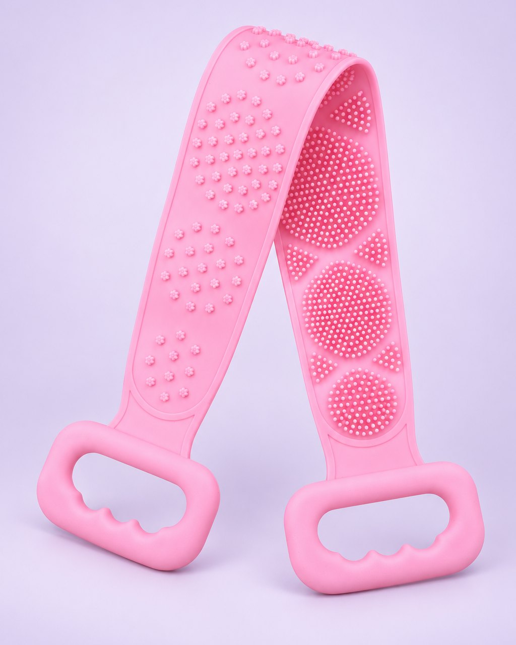 Pink silicone back scrubber strap with a handle at each end