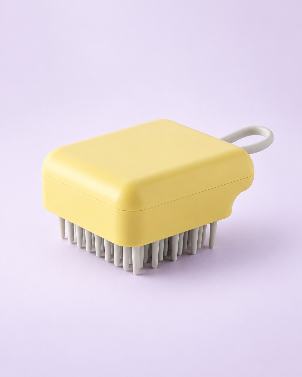Yellow scalp shampoo brush with grey bristles