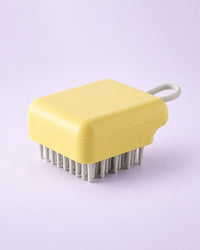 Yellow scalp shampoo brush with grey bristles