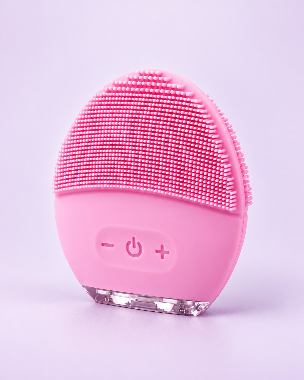 Pink oval silicone face brush with soft nubs and three buttons