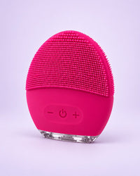Rose red silicone face brush with soft nubs and three buttons