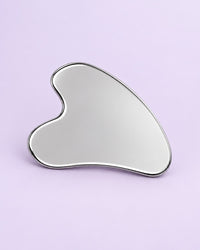 Heart-shaped stainless steel gua sha with a mirror finish