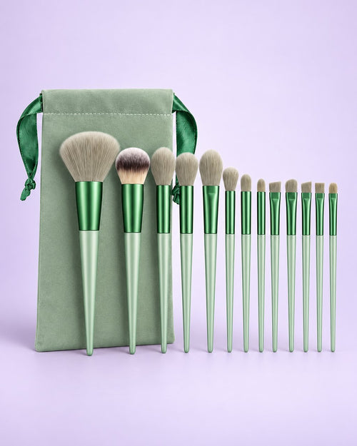 Sage green 13-piece brush set fanned out above its matching drawstring pouch